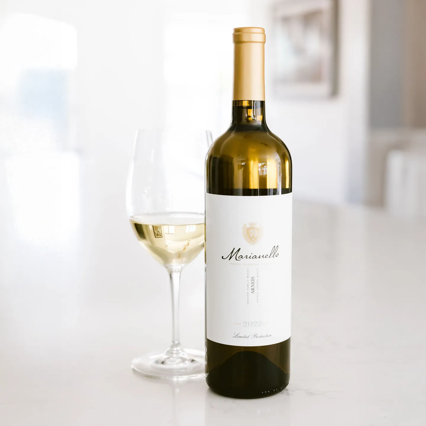 Sanger Wine Bottle and glass on a table